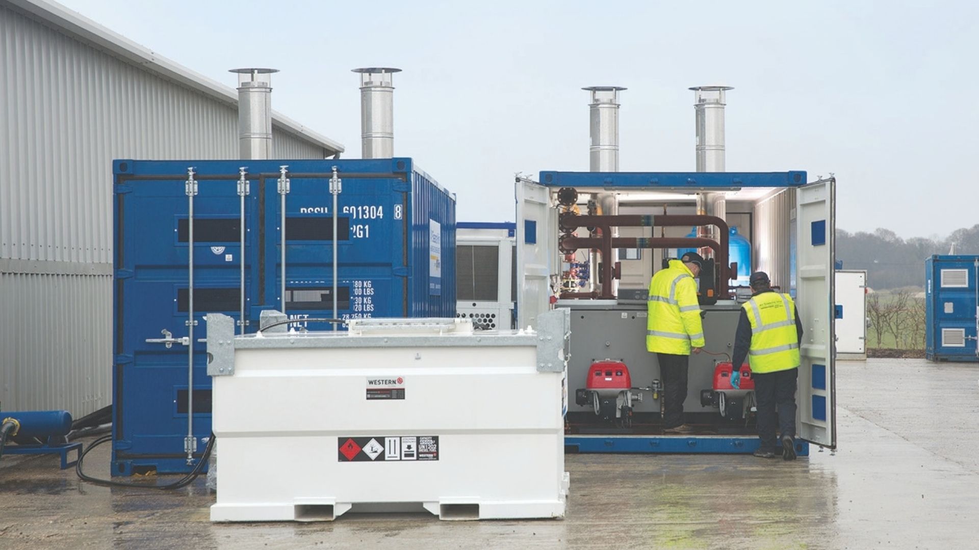 CRS engineers inspecting a containerised boiler plant on site at Andover